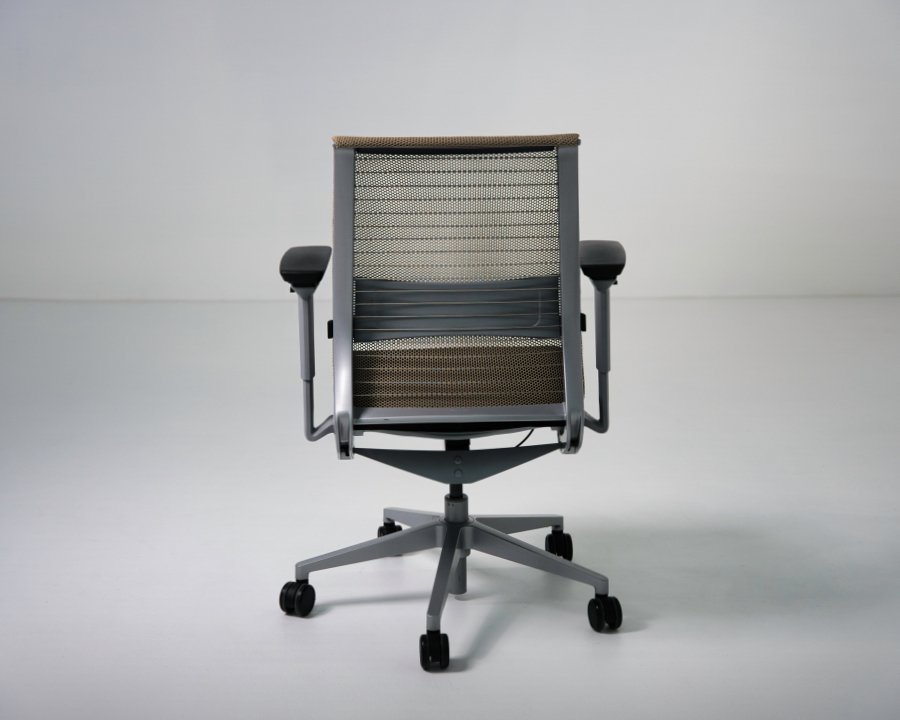 Back view of refurbished Steelcase Think V1 task chair with tan mesh back