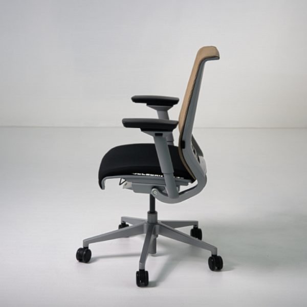 Side view of refurbished Steelcase Think V1 task chair with tan mesh back and black fabric seat