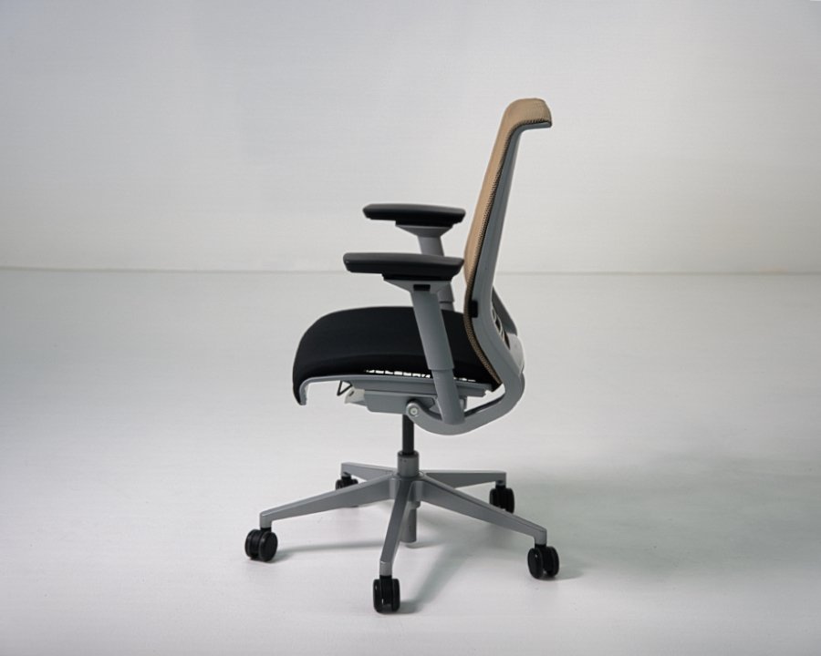 Side view of refurbished Steelcase Think V1 task chair with tan mesh back and black fabric seat