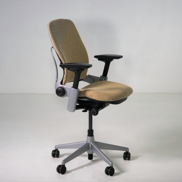 Refurbished Steelcase Leap V2 ergonomic chair in tan patterned fabric side angle view