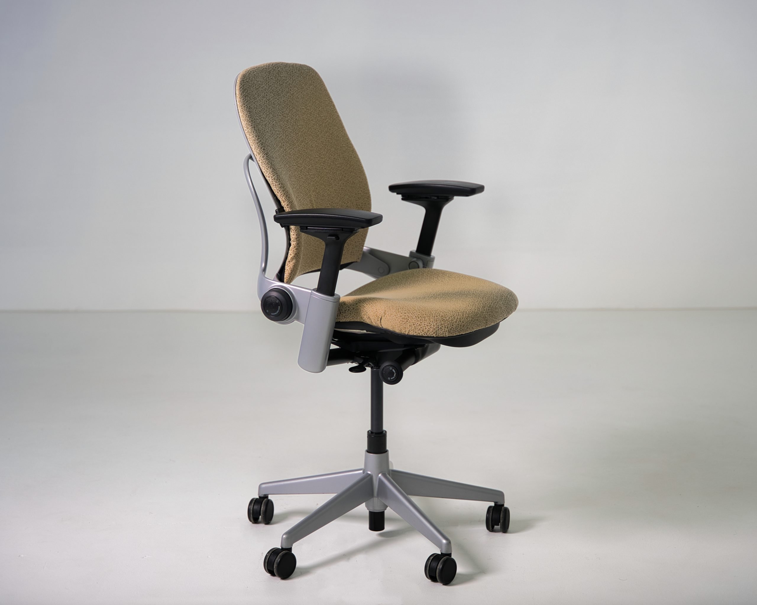 Refurbished Steelcase Leap V2 ergonomic chair in tan patterned fabric side angle view